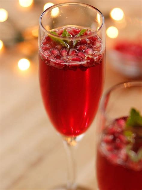 These cocktails are full of all the flavors and sights of the season. Pomegranate Champagne Cocktails Recipe | Ree Drummond | Food Network