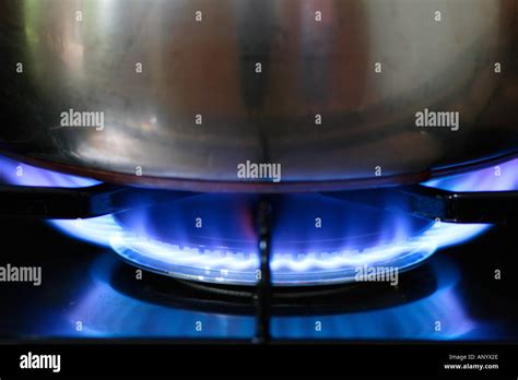 Saucepan Cooking Over Gas Flame On Cooker Hob England United Kingdom