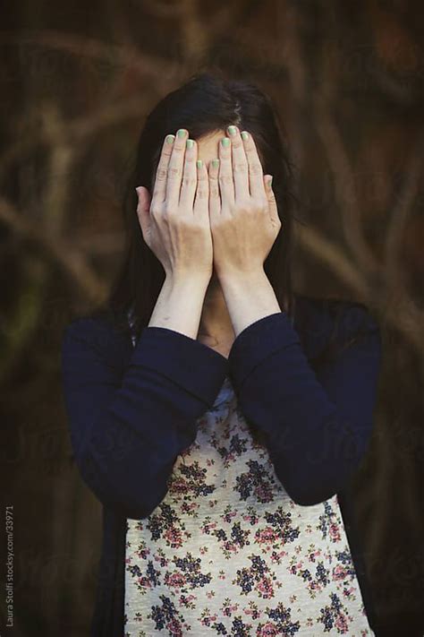 Woman Covers Her Face With Her Hands By Stocksy Contributor Laura