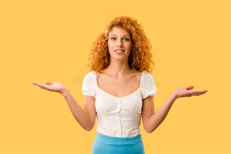 Smiling Woman With Shrug Gesture Isolated On Yellow Stock Photo Image Of Dubium Gesture