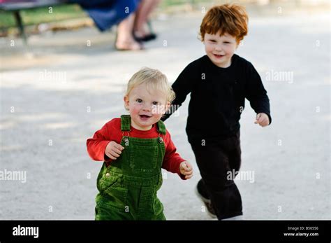 Two Young Children Playing Chase Hi Res Stock Photography And Images