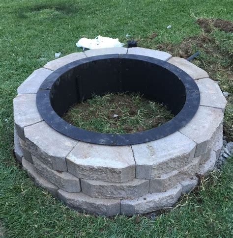 Smokeless fire pit & accessories. My hubby built this awesome fire pit in our back yard this weekend!! Fire ring from Menards ...