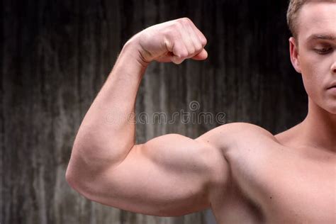 Close Up Of Well Formed Man Demonstrating Biceps Stock Photo Image Of