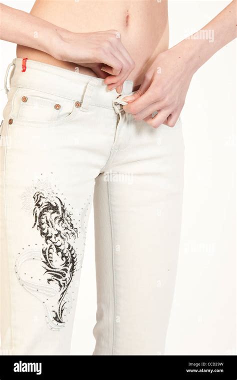 Close Up Of Slim Woman Unzipping Jeans Stock Photo Alamy