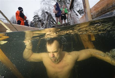 Orthodox Christians Plunge Into Icy Waters For Epiphany Celebration Despite