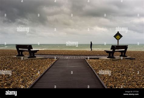 Solitary Man Standing On A Beach Watching The Weather Stock Photo Alamy