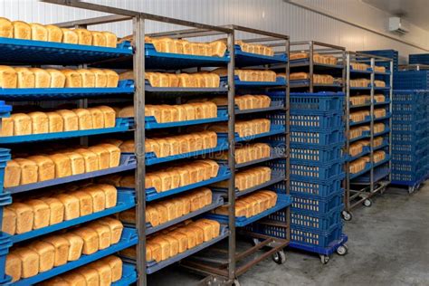 Racks With Fresh Bread In Warehouse In Industrial Bakery Finished