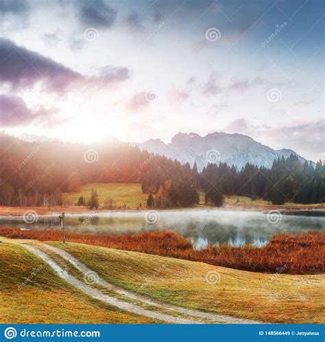 Wonderful Misty Landscape At Germanian Alps Colorful Clouds On Blue