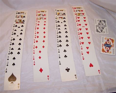 There are a king, queen the four suits have 13 cards each, for a total of 52 cards. Playing Cards, Double Deck Vntg Orig Case, Whitman