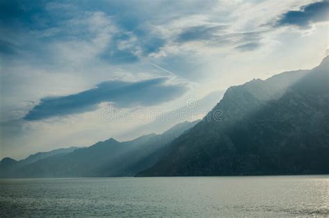 Dramatic Sunset With Mountains View On Lake Garda Italy Stock Photo