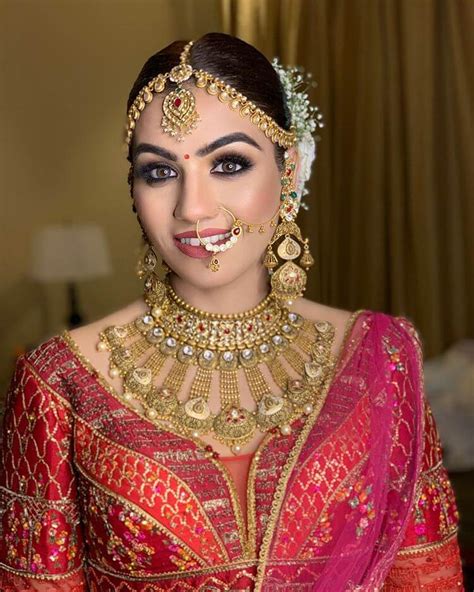 Beautiful Indian Girl In Bride Look Wearing Red Lehanga And Gold