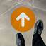 Orange Directional Arrow Floor Sign — D6142 By SafetySigncom