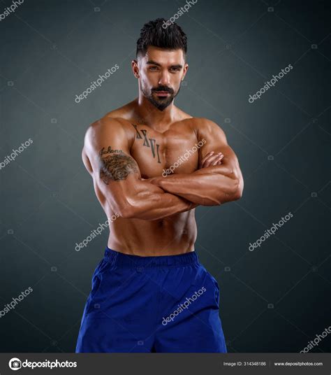 Handsome Shirtless Muscular Men Posing And Flexing Muscles Stock Photo