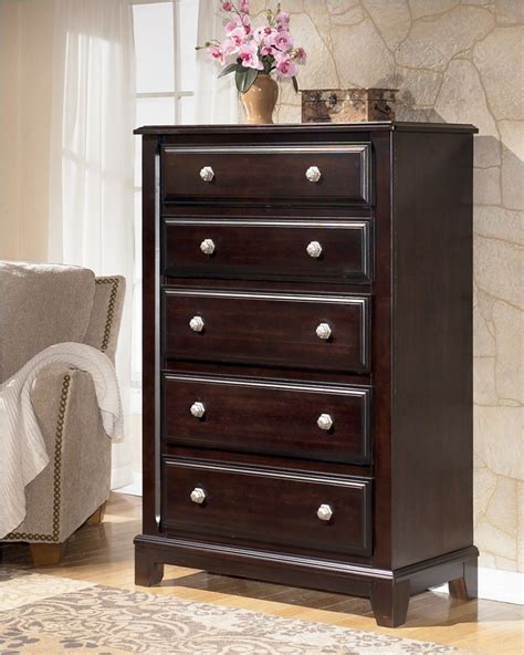 One of the newly set interiors is this bedroom meant for a young couple. Ridgley Chest from Ashley (B520-46) | Coleman Furniture