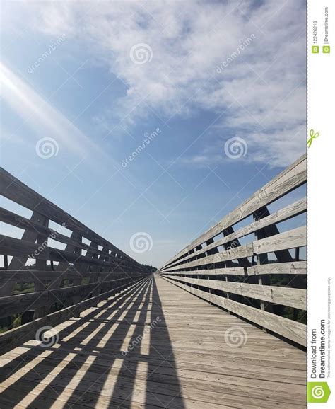 Wooden Bridge Under Cloudy Blue Skies Stock Image Image Of Nebraska