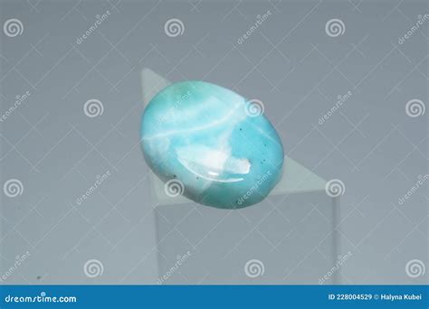 Natural Larimar Stone On A Stand On A White Background Stock Image