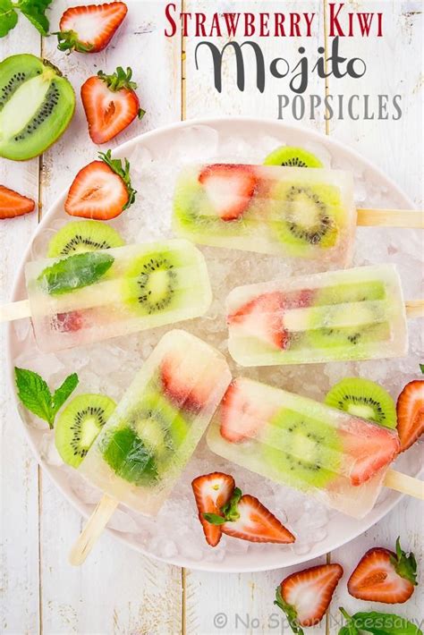 Overhead Shot Of Strawberry Kiwi Mojito Popsicles On A Pink Plate With