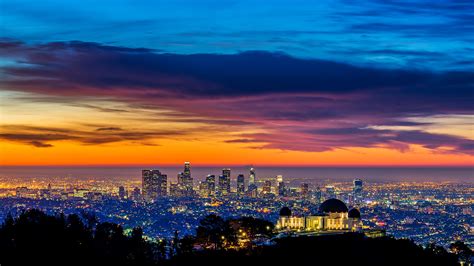 The Griffith Park Observatory With The Downtown Los Angeles Skyline In
