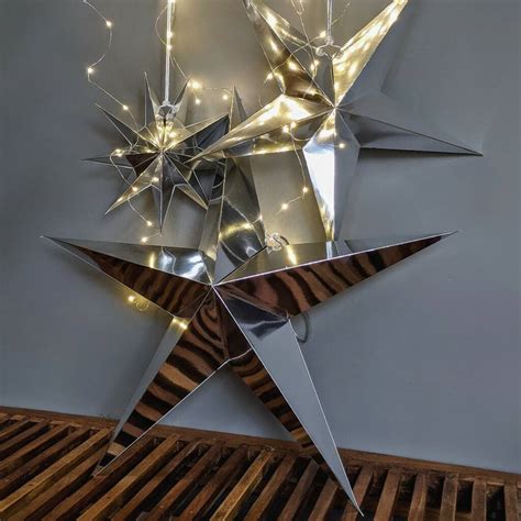 Silver Hanging Paper Star Decoration By The Danes