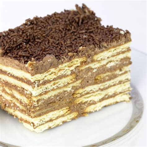 A Layered Cake With Chocolate Sprinkles On Top