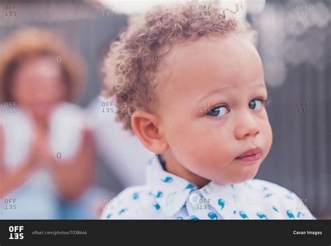 Mixed Race Baby Boy With Blue Eyes Looking At Camera Stock Photo Offset