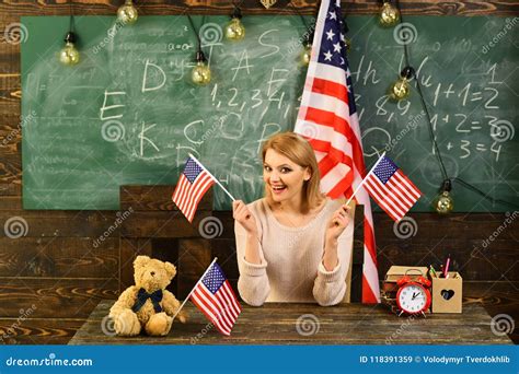 Back To School Or Home Schooling With Teacher Woman In Classroom With