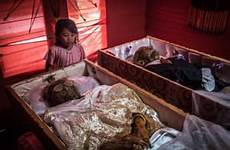indonesia dead people death toraja their bodies corpses cleaning relatives torajan deceased after they keep when rituals funeral indonesian years