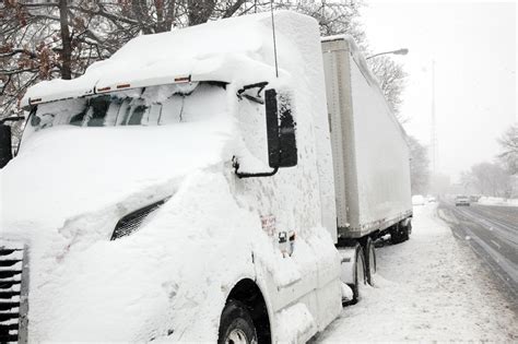 Parked Truck Covered In Thick Layer Of Snow