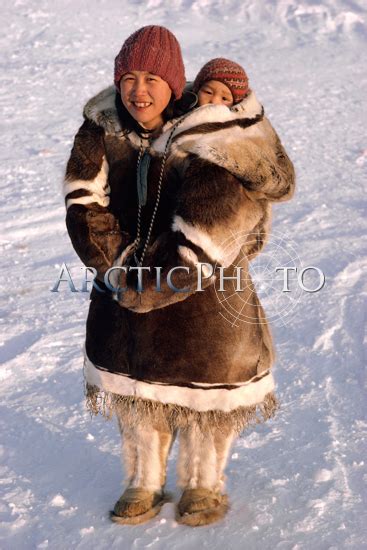 Leah An Inuit Woman Carries Her Baby In An Amaut Hooded Parka On