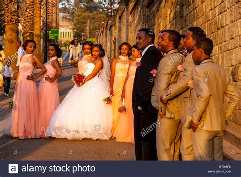A Wedding Party Pose For Photographs Outside The Sheraton Hotel Addis
