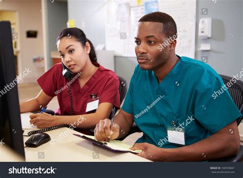Male Female Nurse Working Nurses Station Stock Photo 168769841