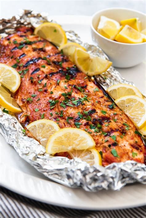 3) place a salmon fillet, oiled side down, atop a sheet of foil. An image of grilled salmon made with a garlic soy brown sugar marinade, then wrapped in foil to ...