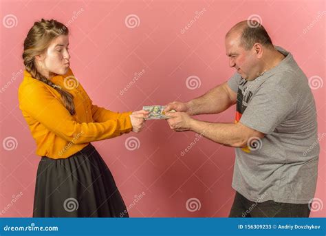 Wife Takes Away Money From Husband Stock Image 13885999