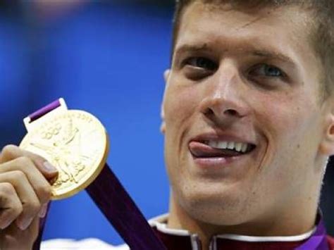 Hungarys Daniel Gyurta Poses With His Gold Medal On The Podium After