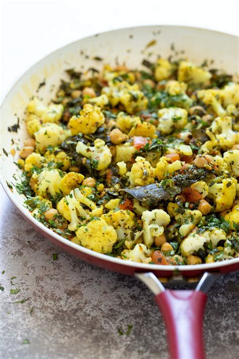 Cauliflower Spinach And Chickpeas With Mustard Seed Curry Leaf Sauce