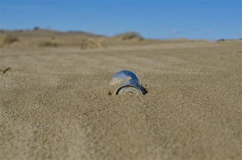 A Can Stuck In The Sand Dunes Stock Photo Image Of Filled Basin