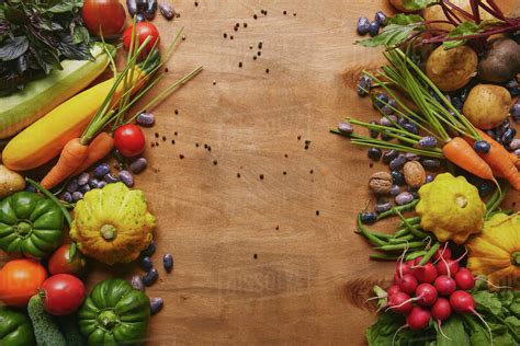 Frame Of Healthy Food Vegetables And Beans On Wooden Table Stock Photo Dissolve