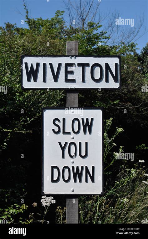 Quaint Village And Road Sign Wiveton Norfolk England Uk Stock Photo