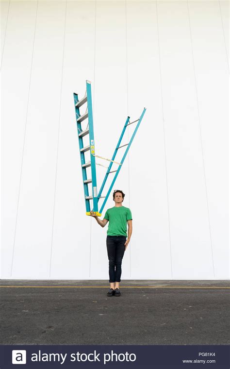 Acrobat Balancing Ladder Upside Down In His Hand Stock Photo Upside Down His Hands Ladder