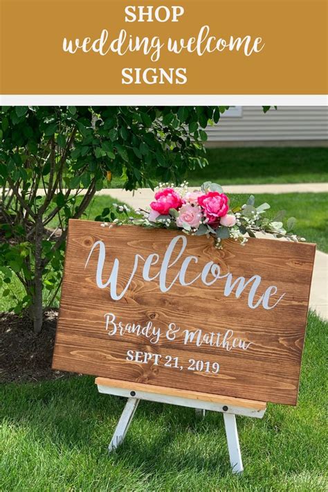 A Welcome Sign With Pink Flowers On It And The Words Shop Wedding
