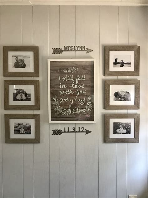 Rustic farmhouse gallery wall with black and white photos and metal art ...