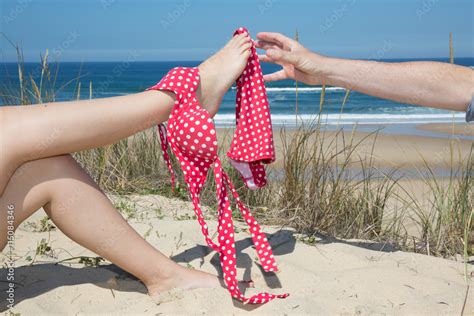 Woman With Bikini On Legs Man Try To Catch On Beach Sea Side Stock