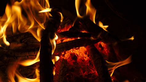 Download Wallpaper 3840x2160 Bonfire Fire Flame Wood Coals Dark 4k