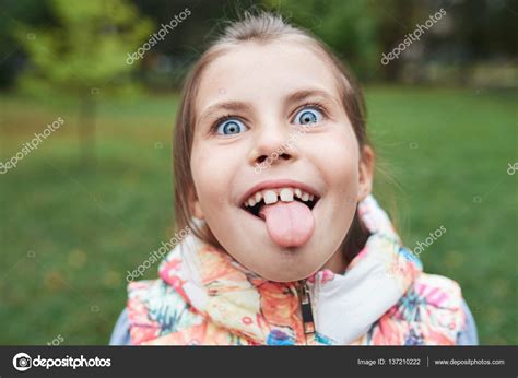Little Girl Sticking Out Her Tongue Stock Photo By ©mavoimages 137210222