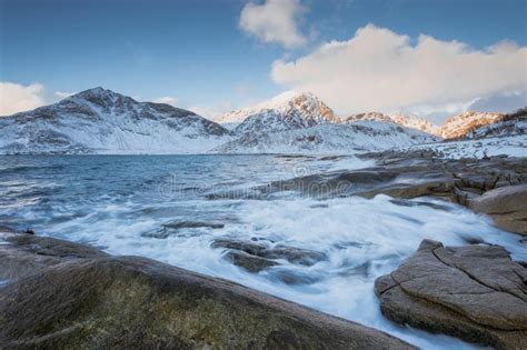 Rocky Coast With Beautiful Mountains And Big Waves In The Winter On The