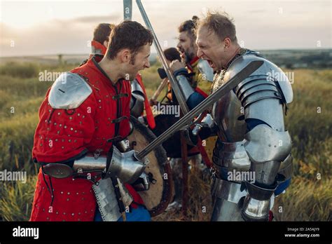 Medieval Knights Fight With Sword And Axe Stock Photo Alamy