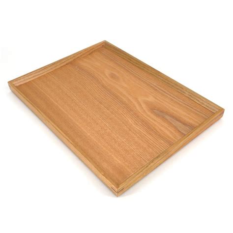 Visually impressive and undeniably useful, this large black capiz tray with handles has a dynamic and dutiful look. large rectangular tray, natural color