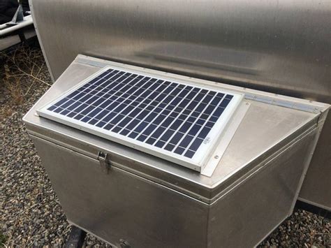 A Metal Box With A Solar Panel On Top