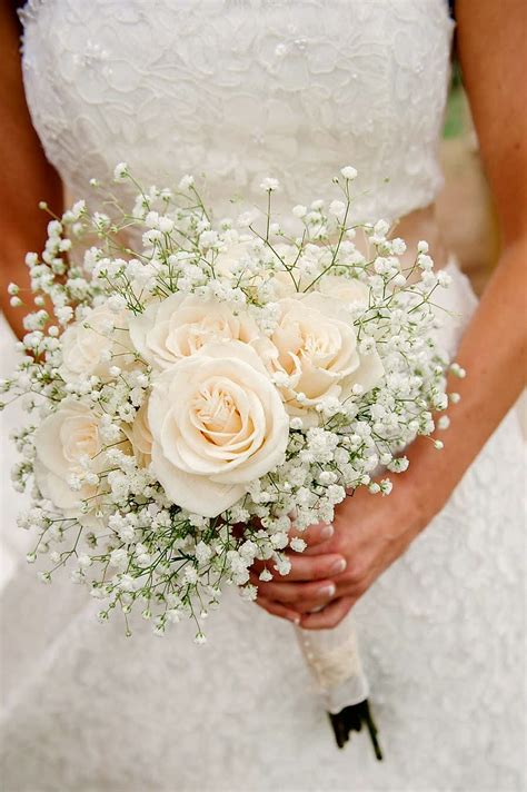 Romantic Bridal Bouquet Showcasing Cream Roses White Gypsophila