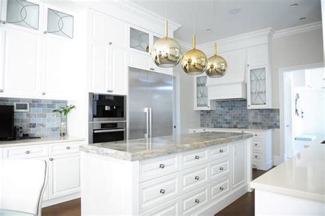 Even with warm brown base cabinets, the cool blue backsplash looks seamless in this design. Gray and Blue Marble Subway Tile Backsplash - Transitional ...